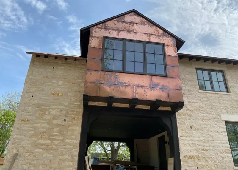 Copper metal panel facade on a stone building for Metal Roof Coating in Clarkston